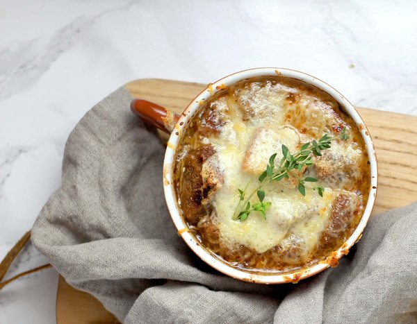 Can You Make a Gourmet French Onion Soup with a Unique Cheese Topping?